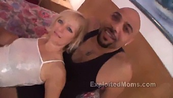 A Caucasian Housewife Engages In Sexual Activity With An African American Man'S Penis In A Steamy Video